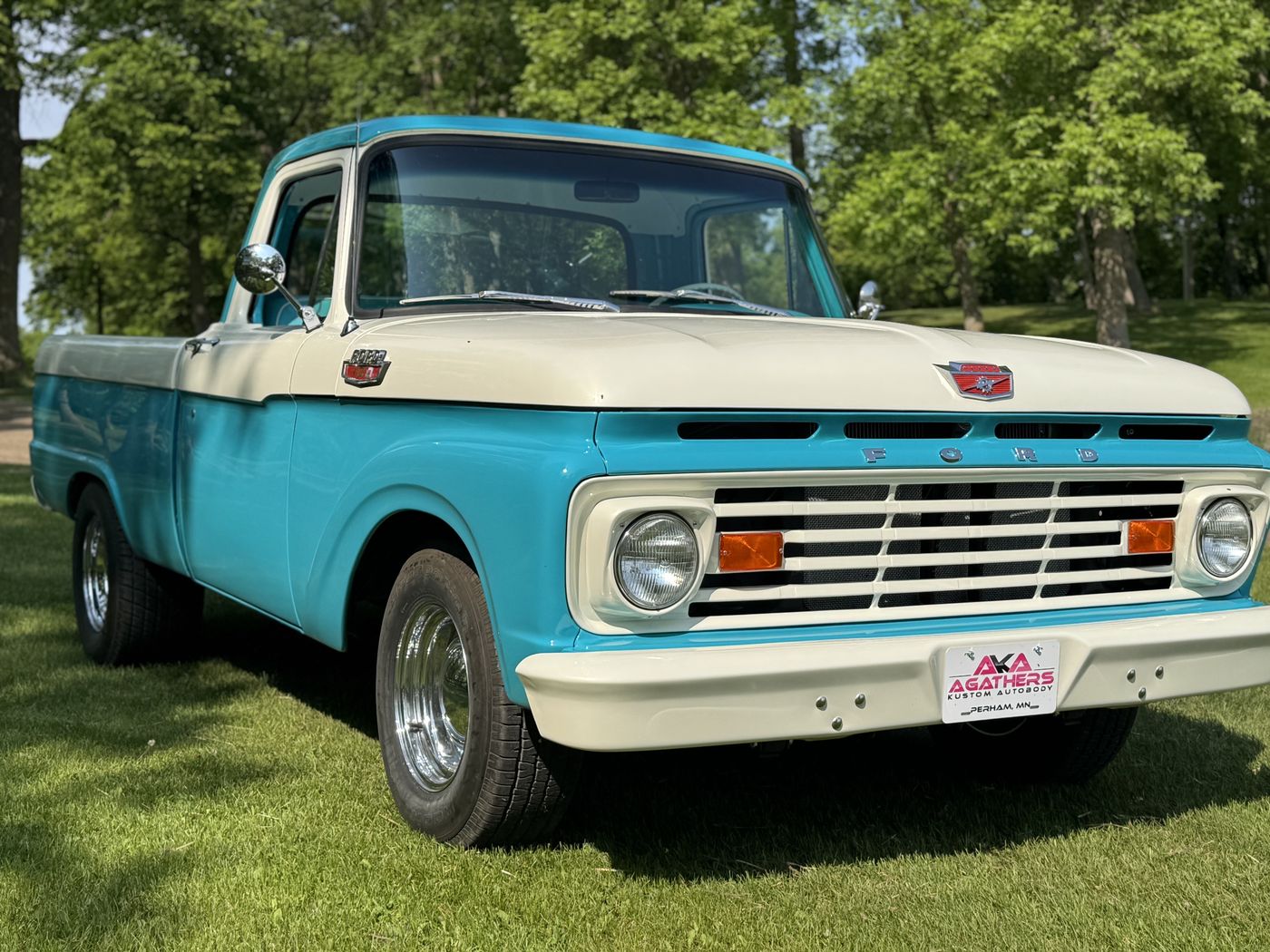 Turquoise and white pickup, front