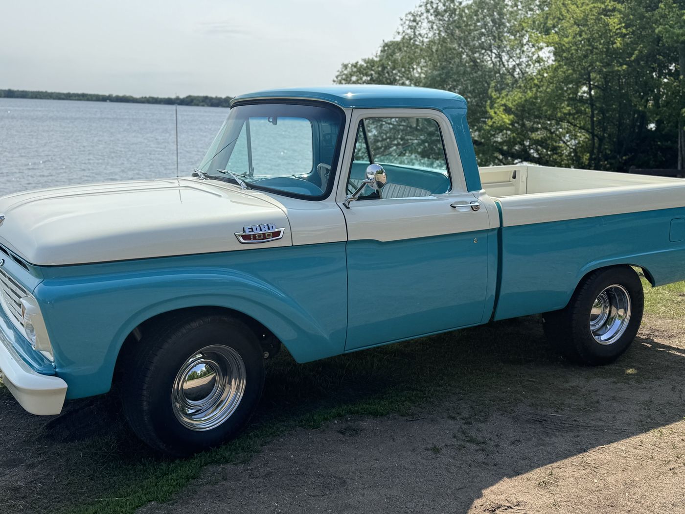 Turquoise and white pickup, lakeside