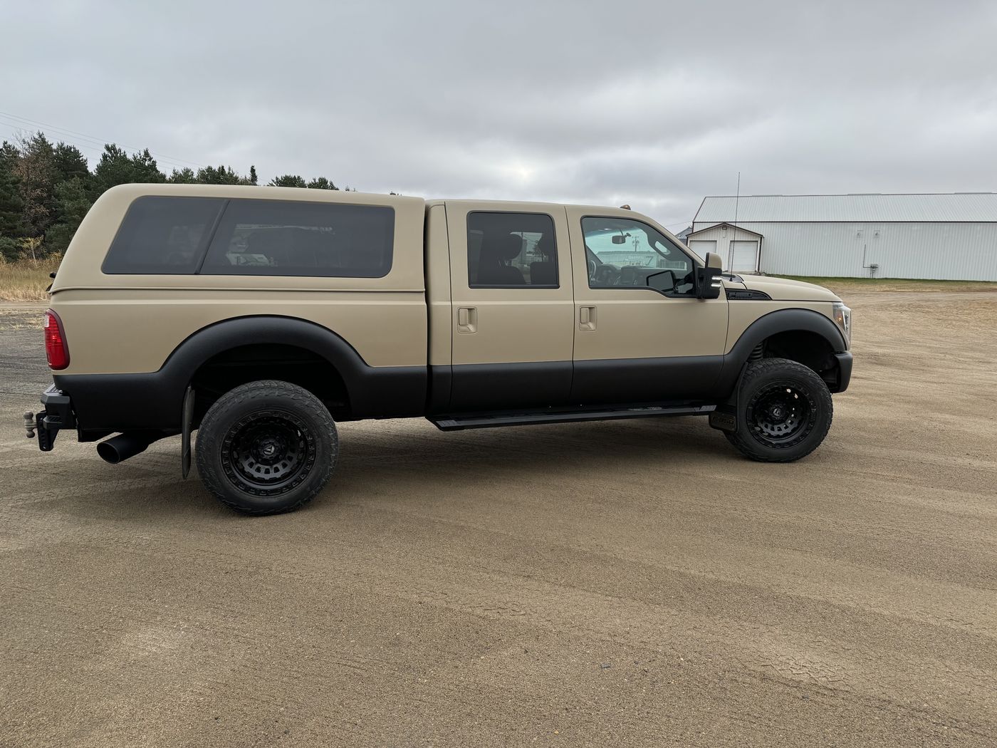 Tan crew cab with matching topper