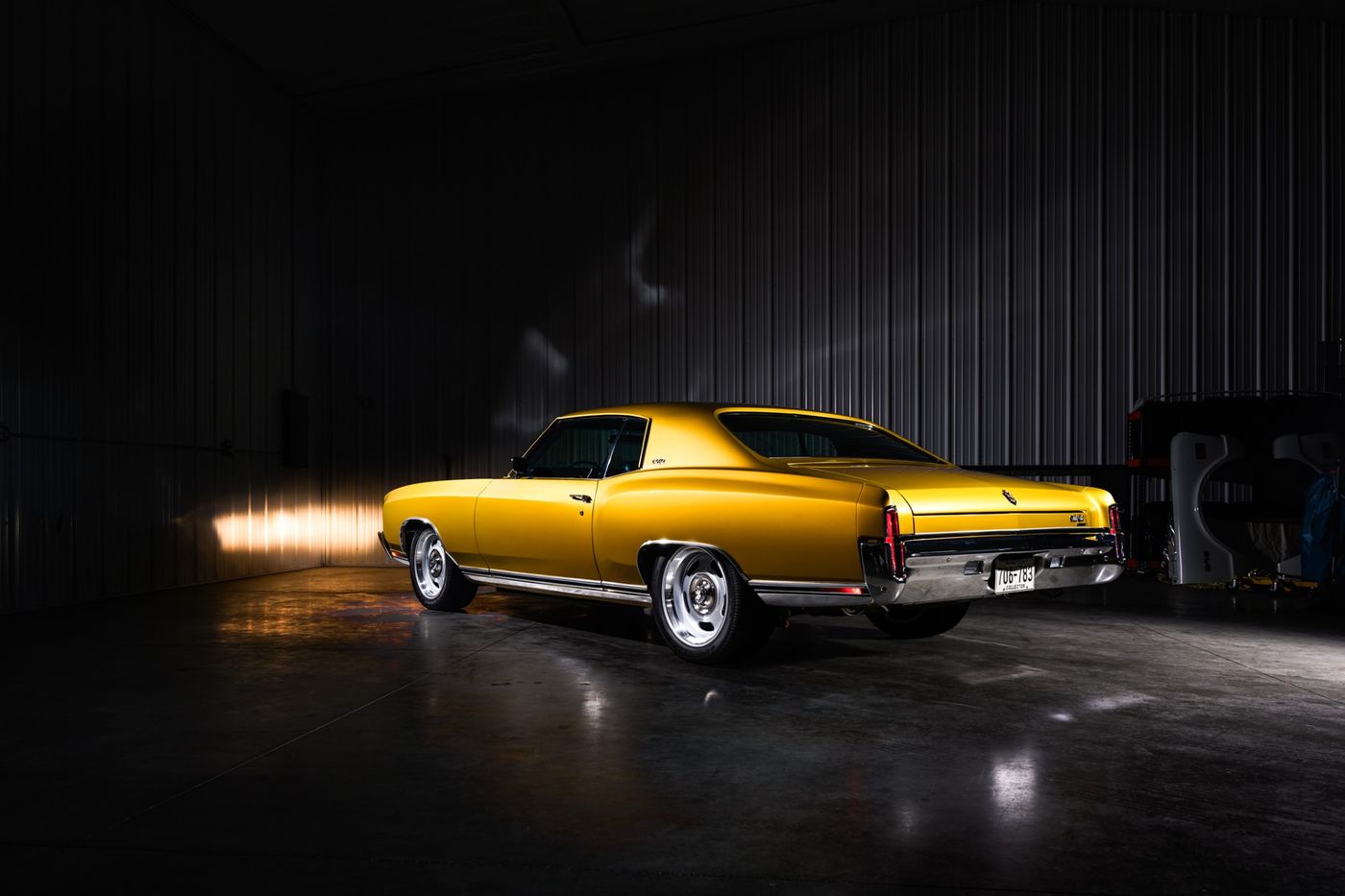 Gold coupe, studio rear three-quarter