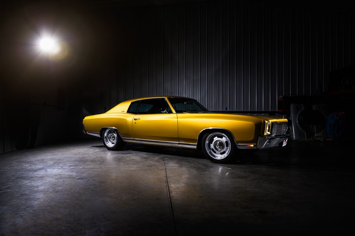 Gold coupe under the lights
