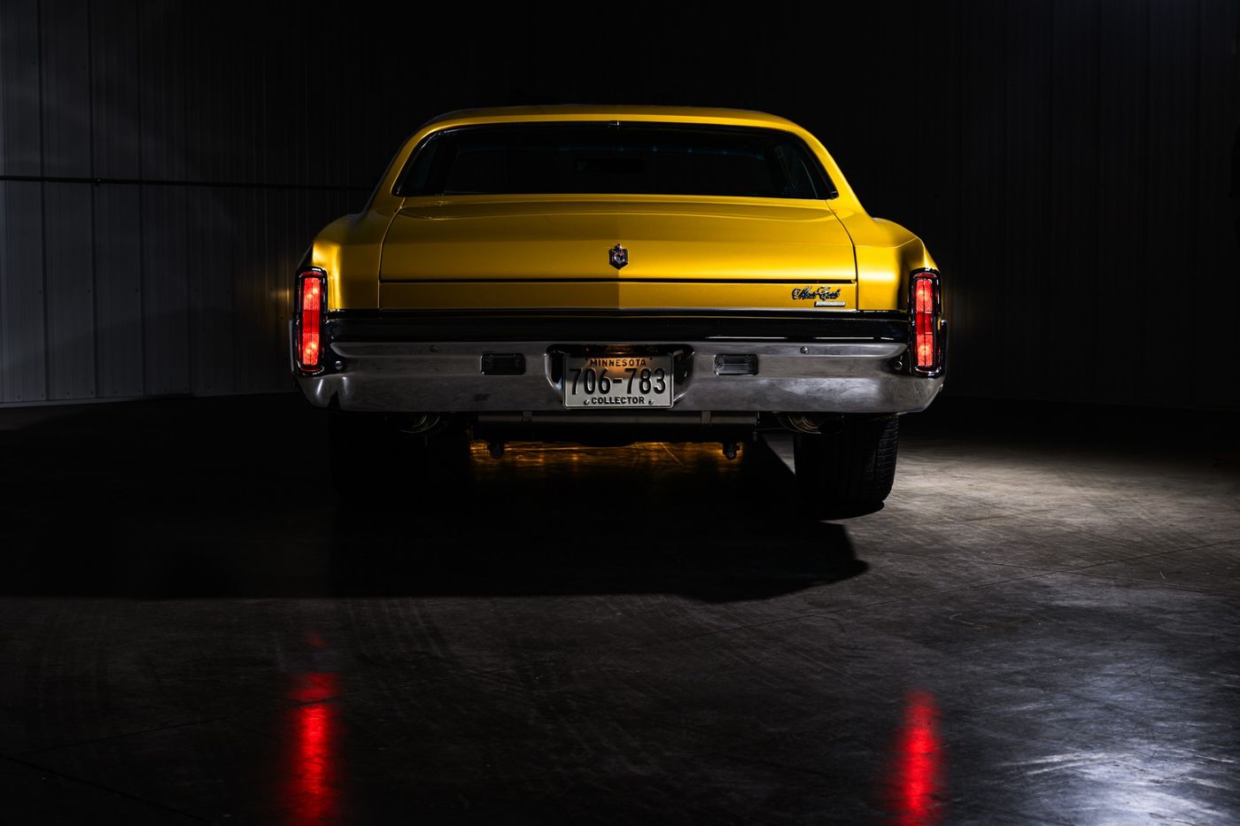 Gold coupe, tail lights lit