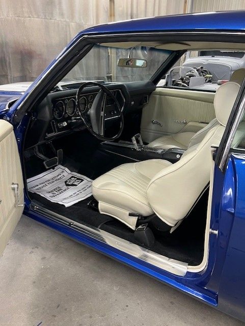 Blue SS coupe, door open