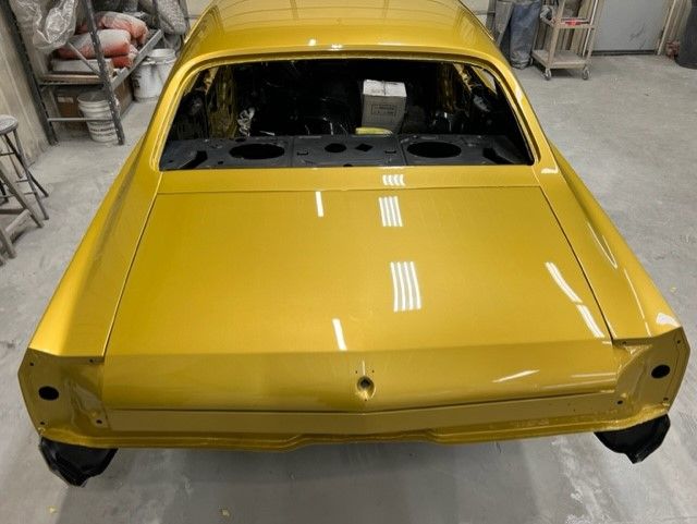Gold coupe, fresh paint in the booth